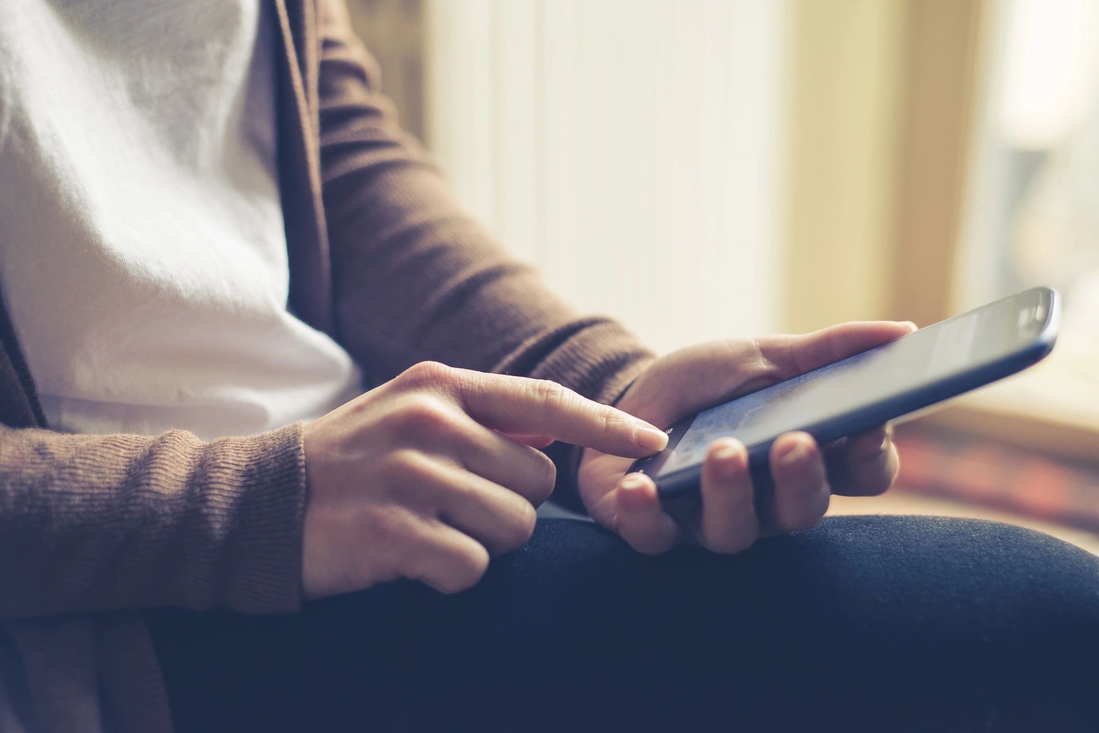 A person using a cellular phone