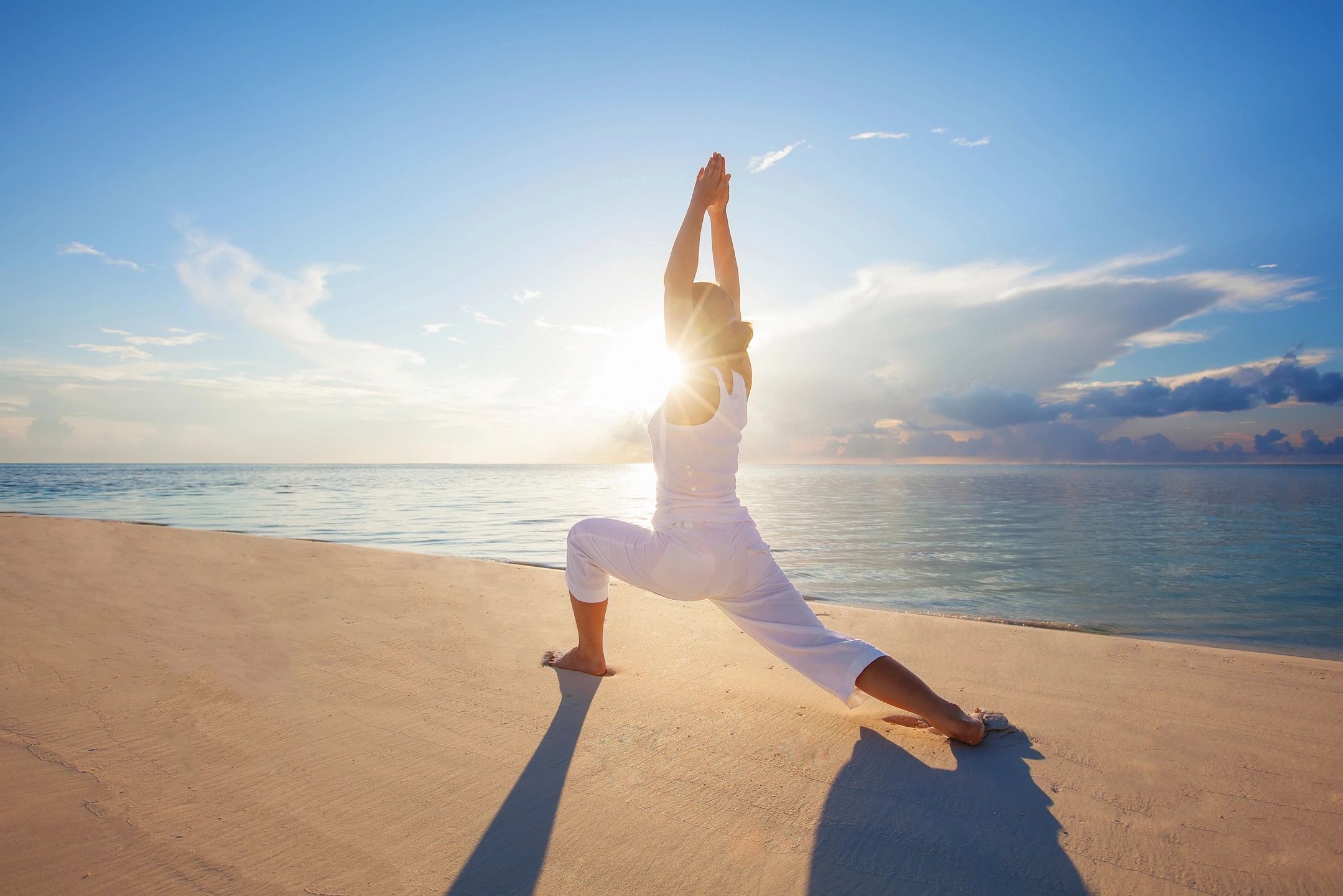 A person exercising on the beach